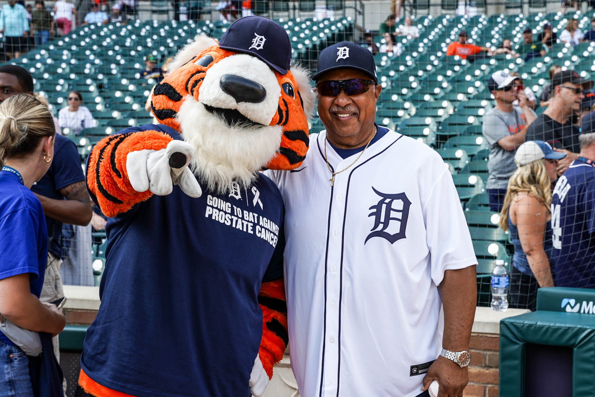 Detroit Tigers mascot Paws and a cancer survivor during Prostate Cancer Survivor Night in 2024.