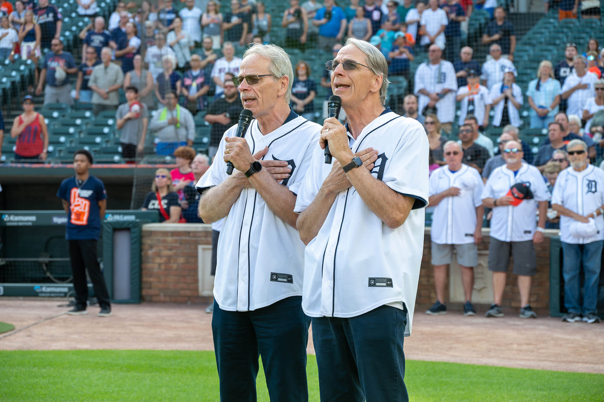 Bruce and Brian Ake sing the National Anthem to kick off the Prostate Cancer Awareness Night Game with the Detroit Tigers.
