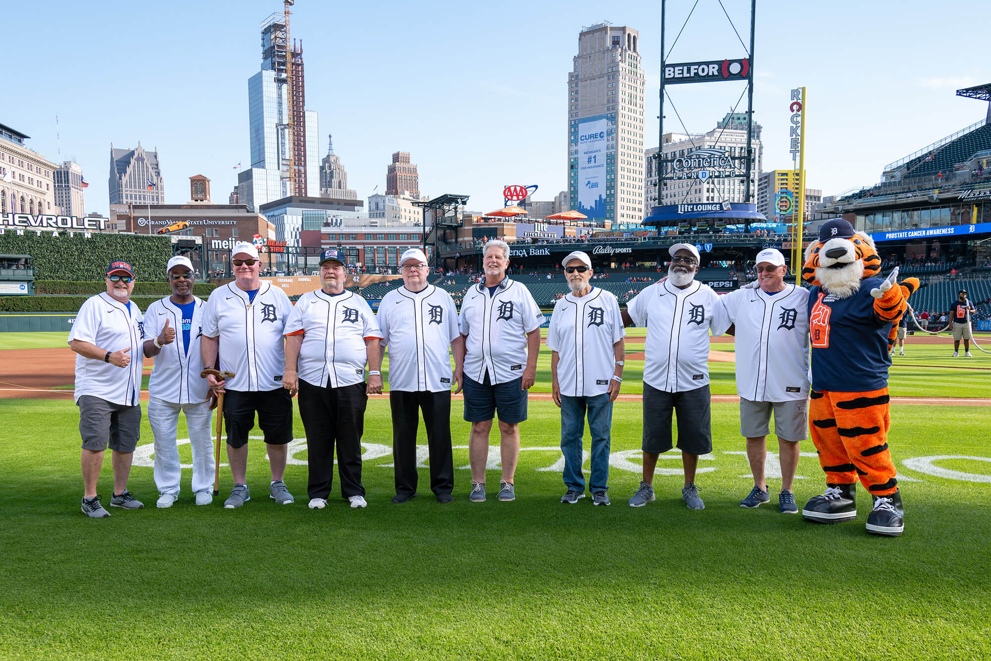 The Karmanos Starting 9 prostate cancer survivors on the field at Comerica Park ahead of the fourth annual Prostate Cancer Awareness Night with the Detroit Tigers.
